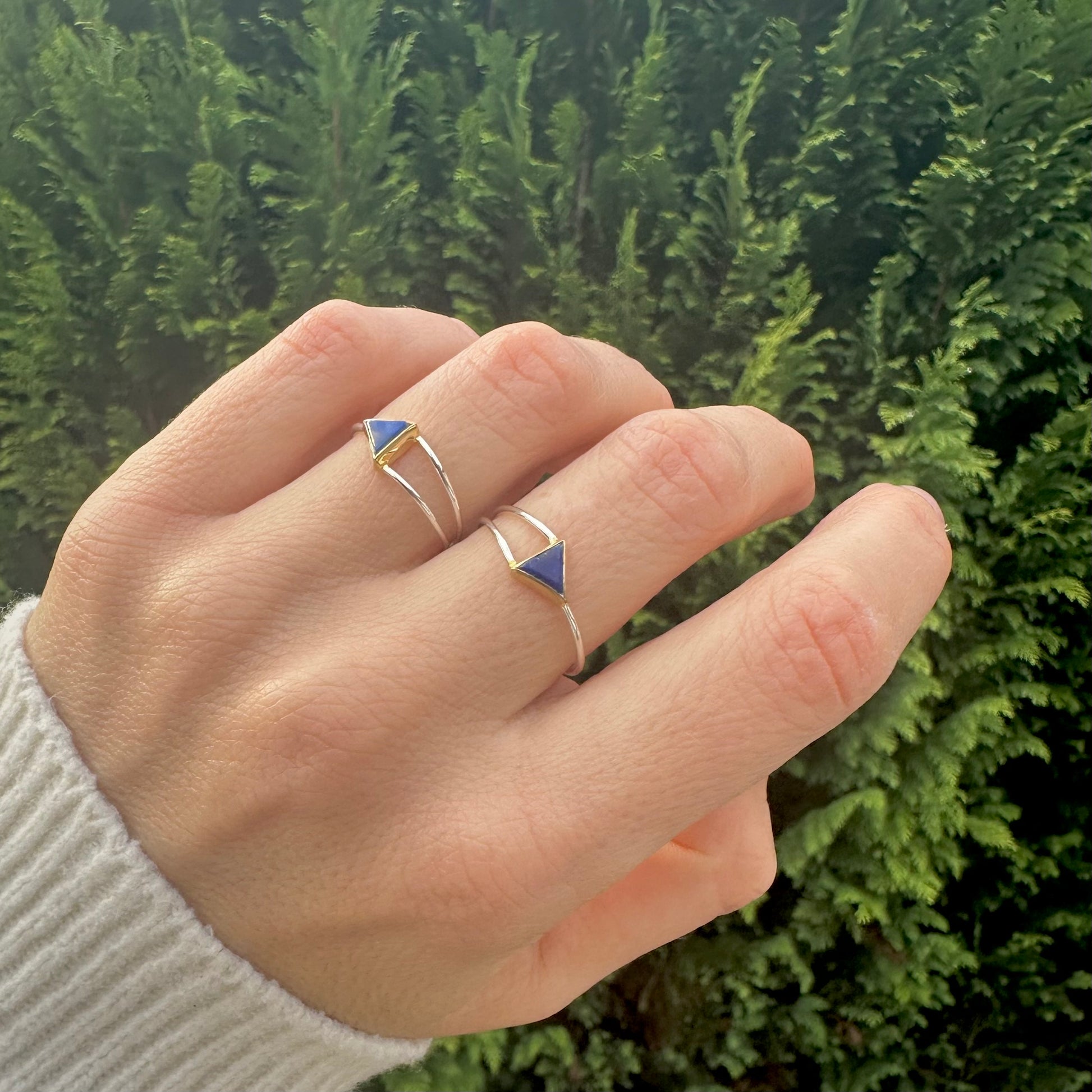 Lapis Lazuli Triangle rings in in silver and gold modelled on ring  and middle fingers